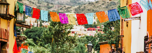 Colorful cloths hanging from a string.